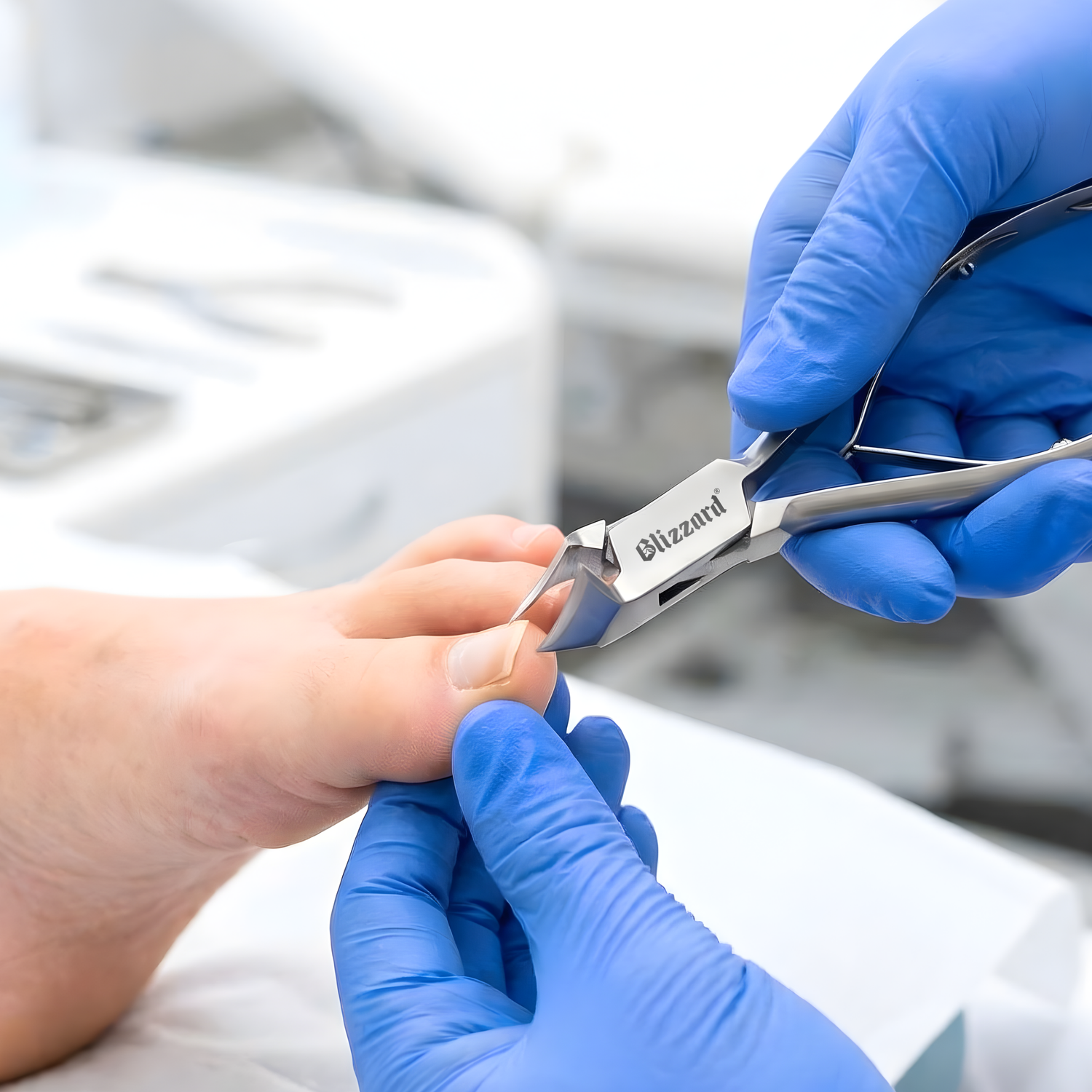 Person with blue gloves using a nail clipper on a blurred background