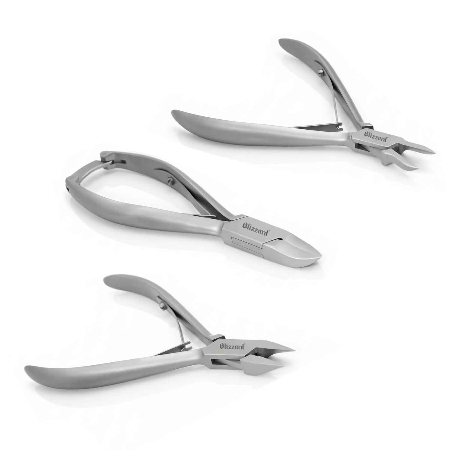 Set of three silver nail clippers on a white background