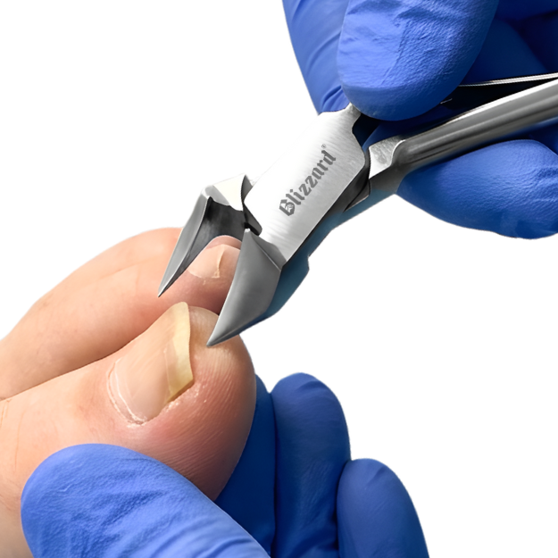 Person wearing blue gloves using a pair of nail clippers on a white background