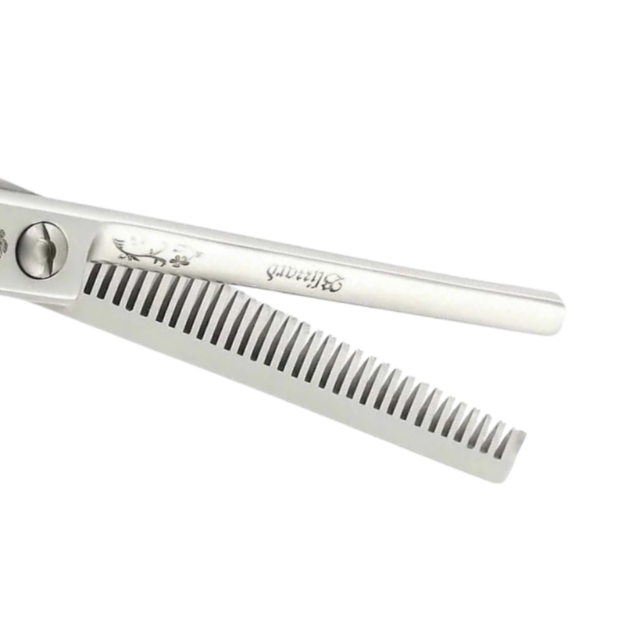 Hair cutting scissors and comb set on a white background