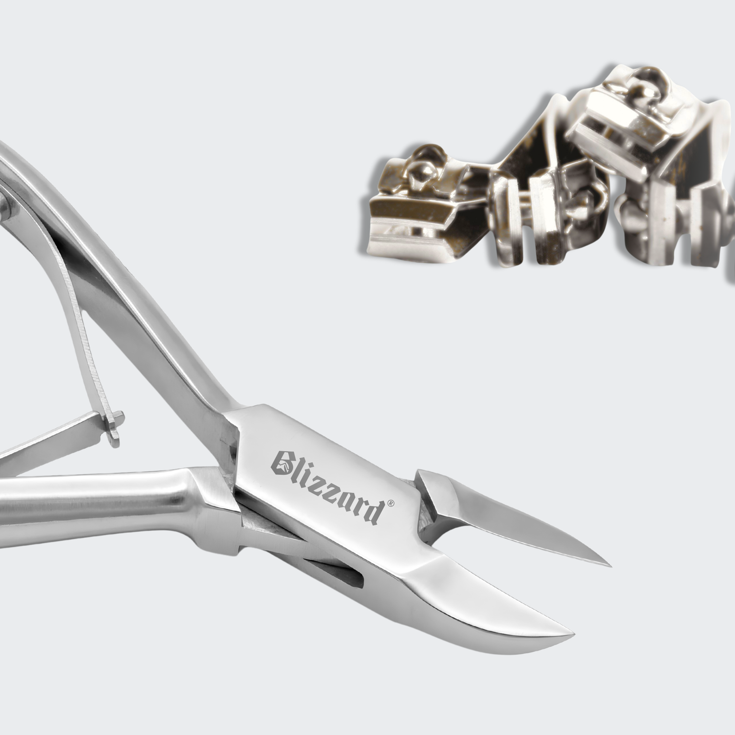 Metal nail clippers with 'Blizzard' branding on a light gray background